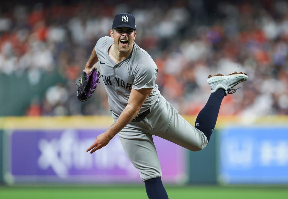 Mar 29, 2024; Houston, Texas, USA; New York Yankees starting pitcher Carlos Rodon (55) delivers a pitch during the first inning against the Houston Astros at Minute Maid Park. Mandatory Credit: Troy Taormina-USA TODAY Sports