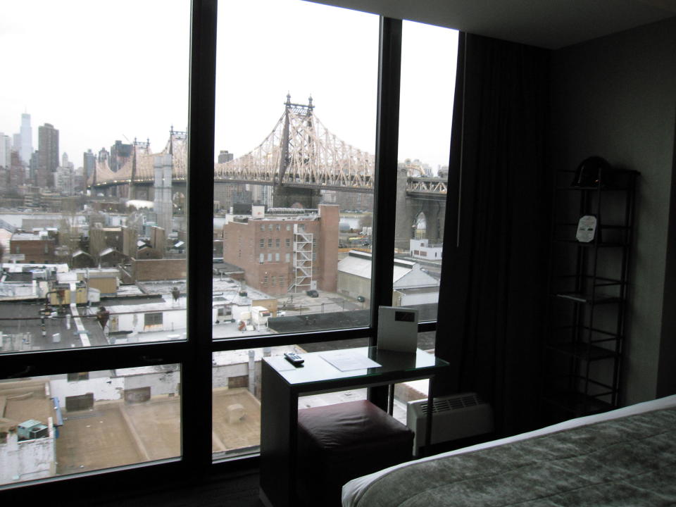 This March 6, 2013 photo shows the view from inside a room at the Z, a boutique hotel in Long Island City, in the Queens borough of New York. The Z is one of 20 hotels in the neighborhood that are luring tourists to the Queens side of the East River with moderate prices. Every room has a view of Manhattan’s skyline and the Ed Koch Queensborough Bridge, also known as the 59th Street Bridge. Tourists will also find museums, waterfront parks and good restaurants in the area, along with easy access to Manhattan. (AP Photo/Beth J. Harpaz)