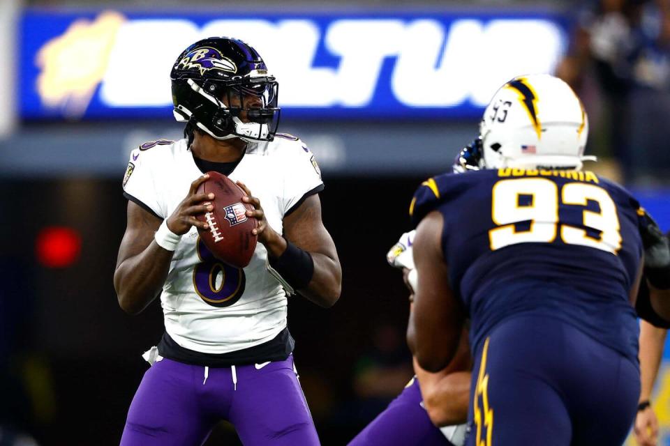 INGLEWOOD, CALIFORNIA – NOVEMBER 26: Lamar Jackson #8 of the Baltimore Ravens looks to throw a pass against the Los Angeles Chargers during the second quarter in the game at SoFi Stadium on November 26, 2023 in Inglewood, California. (Photo by Ronald Martinez/Getty Images)