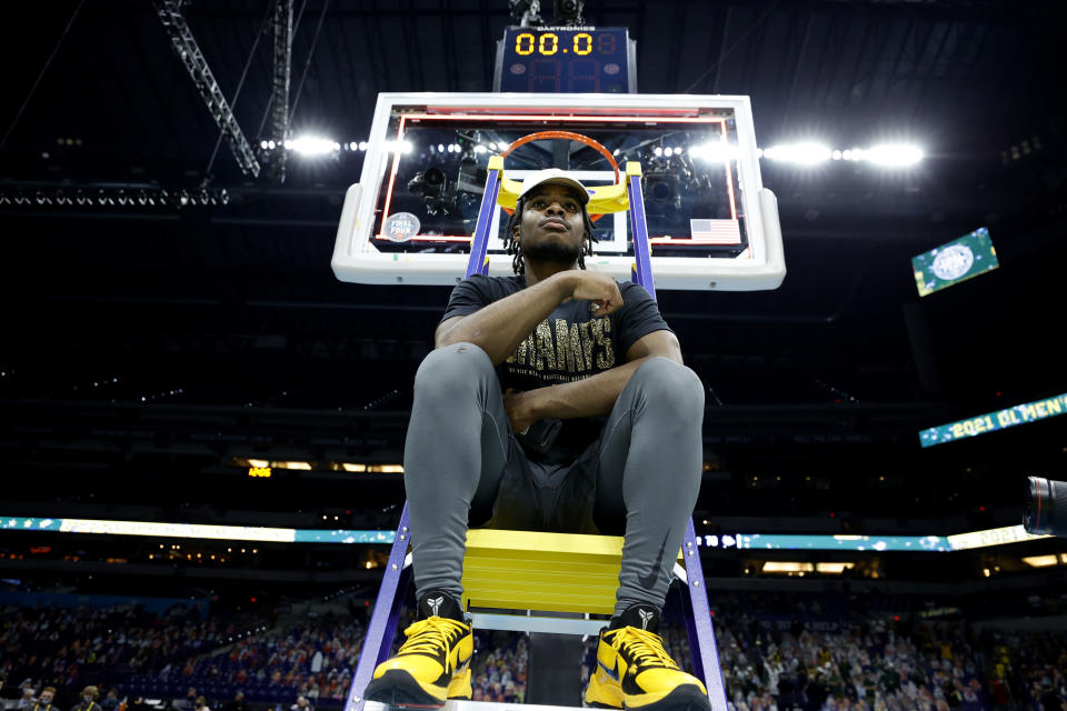 Davion Mitchell #45 of the Baylor Bears sits on a ladder with the trophy after defeating the Gonzaga Bulldogs in the National Championship game of the 2021 NCAA Men's Basketball Tournament at Lucas Oil Stadium on April 05, 2021 in Indianapolis, Indiana. The Baylor Bears defeated the Gonzaga Bulldogs 86-70. (Photo by Tim Nwachukwu/Getty Images)