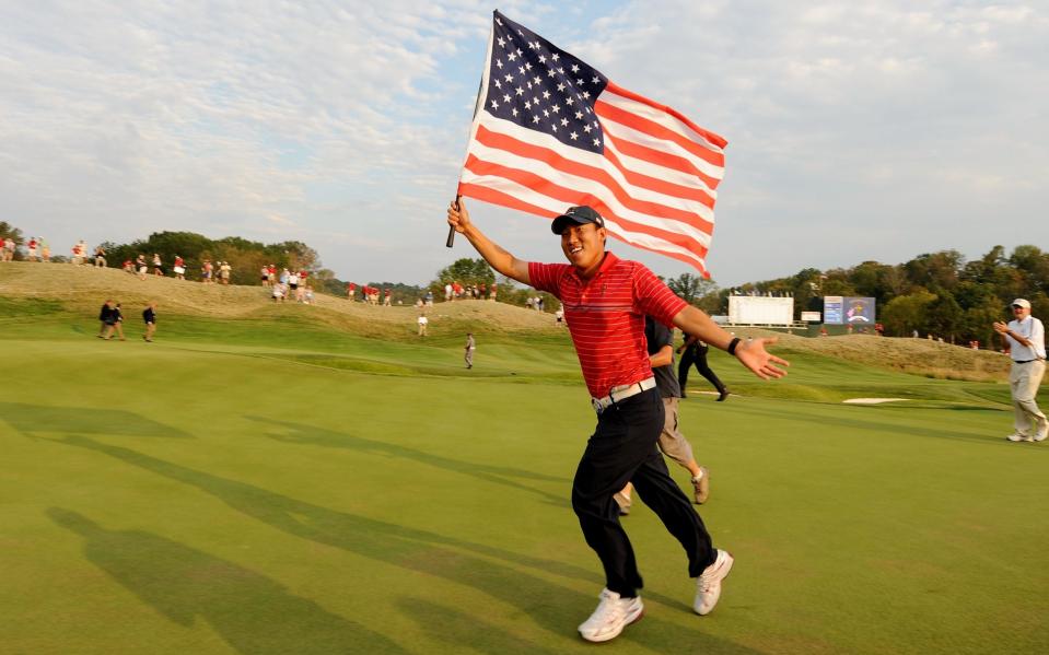 Anthony Kim of the USA celebrates with an American flag after the USA 16 1/2 - 11 1/2 victory on the final day of the 2008 Ryder Cup