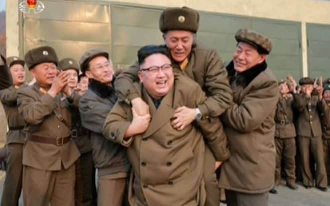 A North Korean official jumps on Kim jon-un's back - KCNA