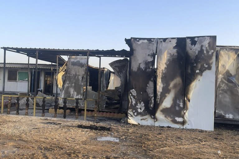 This photo released by the Basra Police shows structures belonging to a demining project run by the Danish Refugee Council after the protesters burned them, 50 kilometers east of Basra, Iraq, Saturday, July 22, 2023, following reports that an ultranationalist group burned a copy of the Quran in front of the Iraqi Embassy in the Danish capital, Copenhagen. (Basra Police via AP)