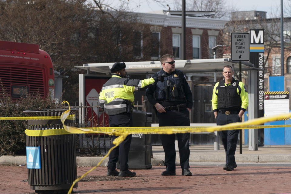 Washington Metropolitan Police officers investigate a shooting at the Potomac Avenue Metro Station in Southeast Washington, Wednesday, Feb. 1, 2023. An armed man shot three people, killing one, Wednesday in a morning rampage that started on a city bus and ended in a Metro tunnel after passengers attacked and disarmed him. (AP Photo/Manuel Balce Ceneta)