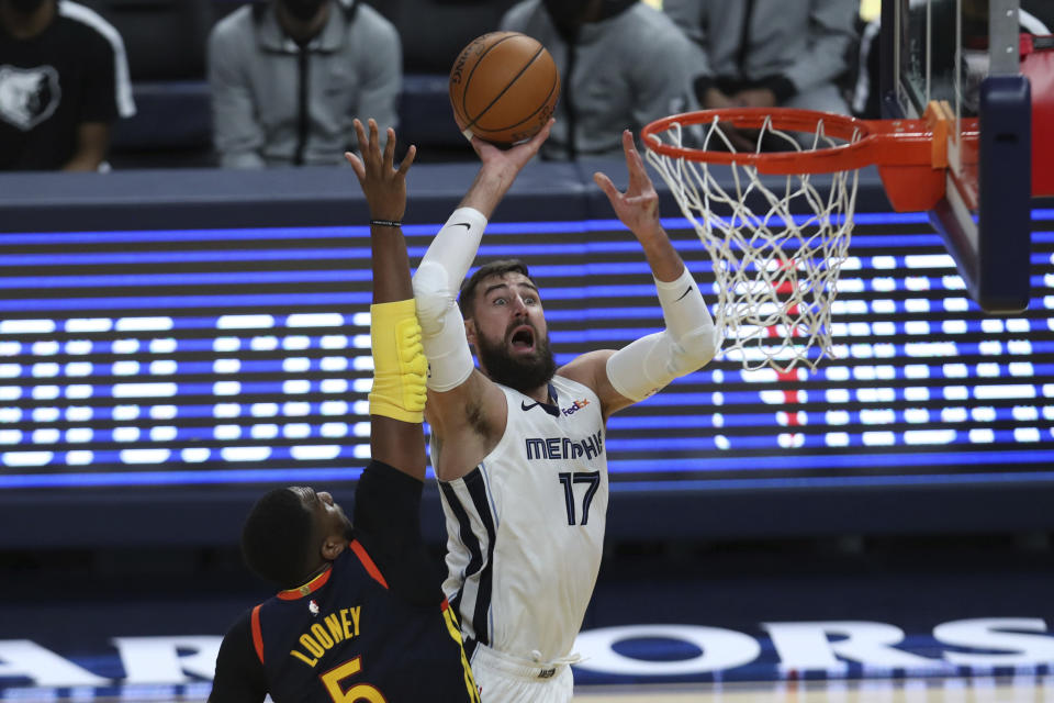 FILE - In this May 21, 2021, file photo, Memphis Grizzlies' Jonas Valanciunas (17) shoots against the Golden State Warriors' Kevon Looney (5) during the second half of an NBA basketball Western Conference play-in game in San Francisco. A person familiar with the situation says the Grizzlies have agreed to trade Valanciunas to the New Orleans Pelicans in exchange for center Steven Adams, guard Eric Bledsoe and an exchange of first-round choices in this week’s draft. The person spoke to The Associated Press on condition of anonymity on Monday, July 26, 2021, because no trade can become official until Aug. 6. (AP Photo/Jed Jacobsohn, File)