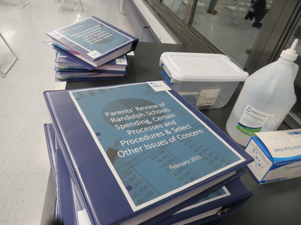 A resident parent group presented these binders with hundreds of pages of school district documents they say raise concerns about spending and other issues at the Randolph Board of Education meeting at Randolph Middle School on Feb. 23, 2023.