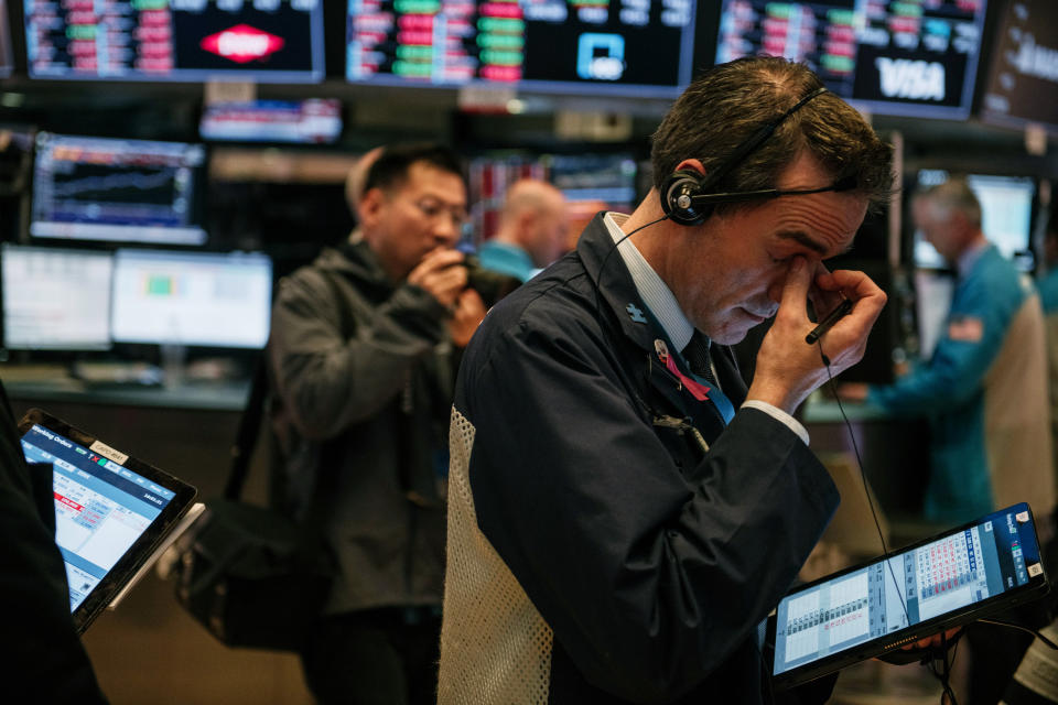 NEW YORK, NY - FEBRUARY 25: Traders work through the closing minutes of trading Tuesday on the New York Stock Exchange floor on February 25, 2020 in New York City. Fueled by deepening concerns of the Coronavirus becoming a global pandemic, the stock market plunged Tuesday, with the Dow Jones Industrial Average losing almost 900 points. (Photo by Scott Heins/Getty Images)