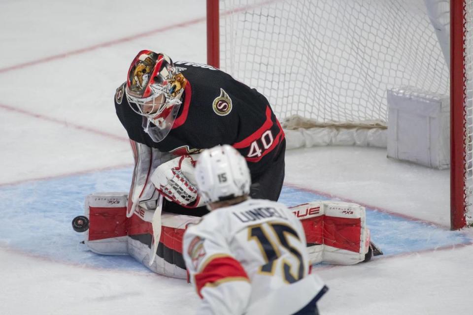 Mar 27, 2023; Ottawa, Ontario, CAN; Ottawa Senators goalie Mads Sogaard (40) makes a save in front of Florida Panthers center Anton Lundell (15) in the third period at the Canadian Tire Centre. Mandatory Credit: Marc DesRosiers-USA TODAY Sports