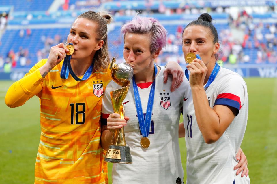 Ashlyn Harris, Megan Rapinoe  and Ali Krieger celebrate after defeating the Netherlands in the 2019 World Cup final.