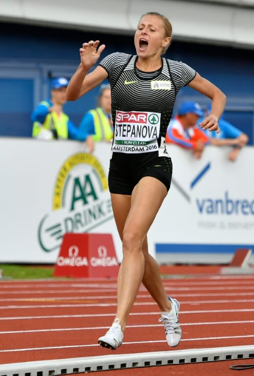 Russia's Yuliya Stepanova grimaces as she is injured while competing in the women's 800 m race during the European Athletics Championships at the Olympic stadium in Amsterdam on July 6, 2016