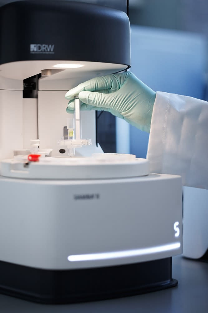 Undated handout photo issued by Cambridge University Hospitals showing research nurses from the NIHR Clinical Research Facility processing patient samples using SAMBA II testing machines at AddenbrookeÕs Hospital in Cambridge.