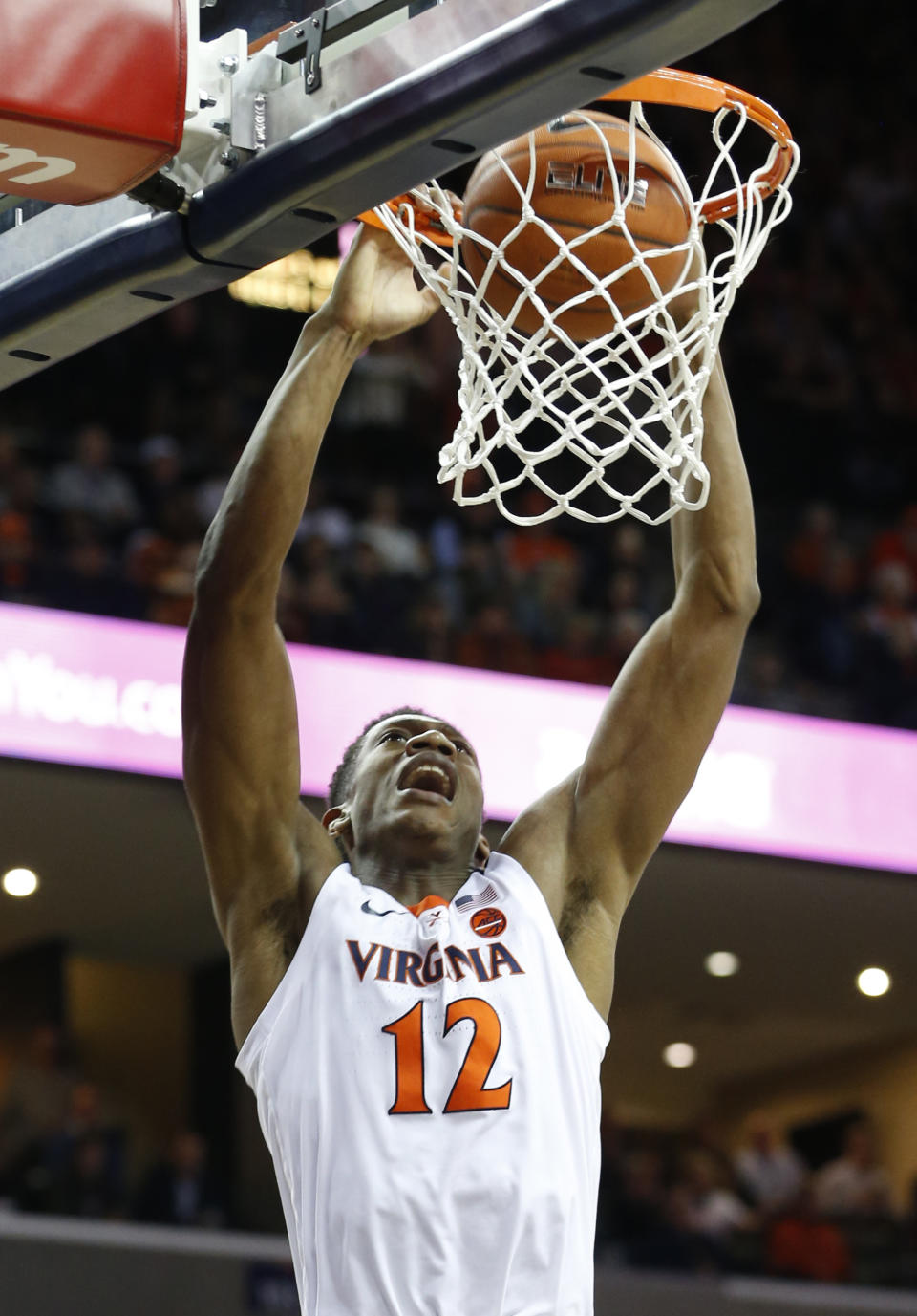 Virginia guard De'Andre Hunter (12) slams home a dunk during the first half of an NCAA college basketball game against Virginia Tech, in Charlottesville, Va., Tuesday, Jan. 15, 2019. (AP Photo/Steve Helber)