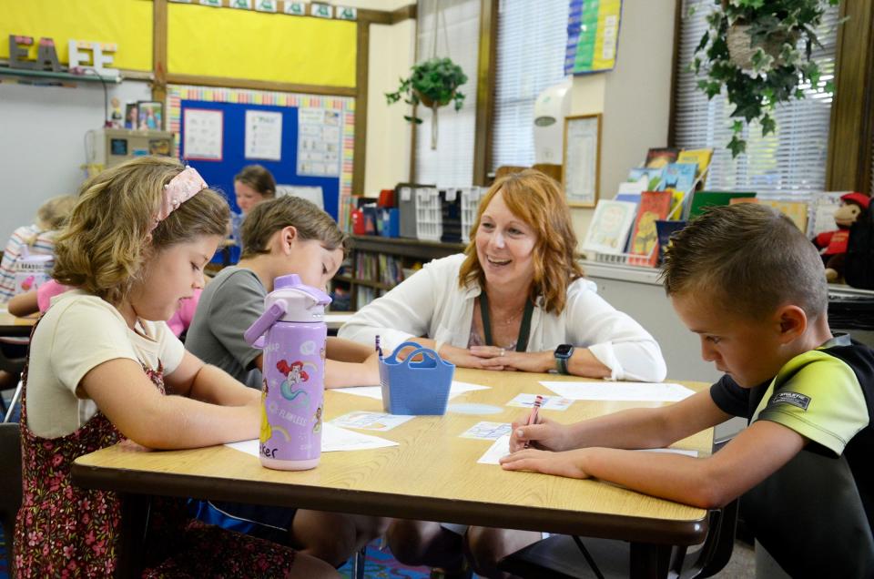 First grade teacher Suzanne Nayback talks to students on Tuesday, Sept. 5, 2023 as the first day of the 2023-24 school year gets underway at Central Elementary School in Petoskey.