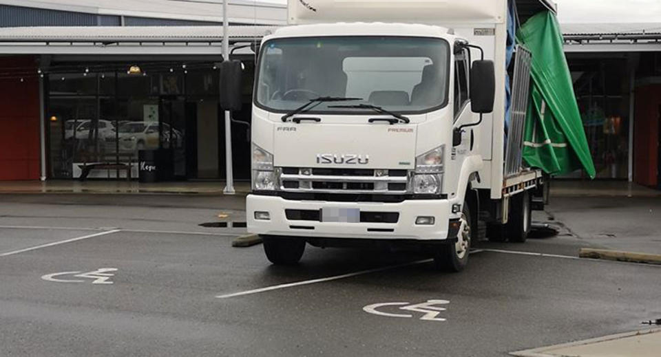 A truck is pictured parked across two disabled parks outside The Tailrace Centre in Launceston.