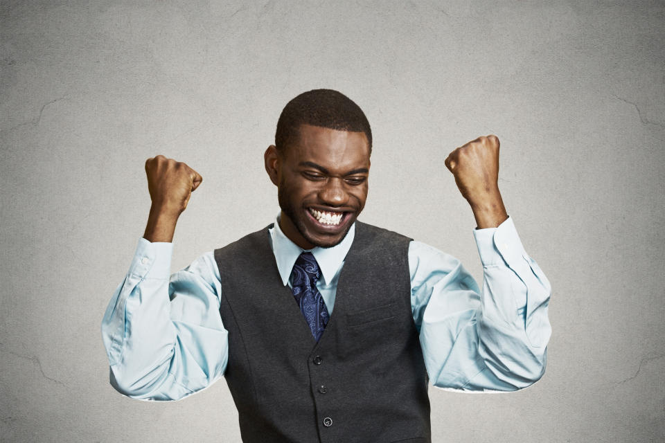 Happy guy wearing a vest and tie.