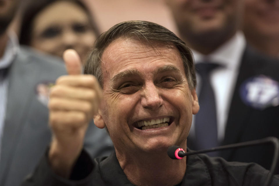 Presidential candidate Jair Bolsonaro, of the right wing Social Liberal Party speaks during a press conference in Rio de Janeiro, Brazil, Thursday, Oct. 11, 2018. Bolsonaro will face Workers Party presidential candidate Fernando Haddad in a presidential runoff on Oct. 28. (AP Photo/Leo Correa)