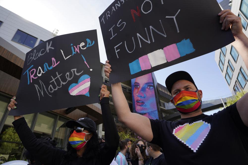 People protest outside the Netflix building on Vine Street in the Hollywood section of Los Angeles, Wednesday, Oct. 20, 2021. (AP Photo/Damian Dovarganes)