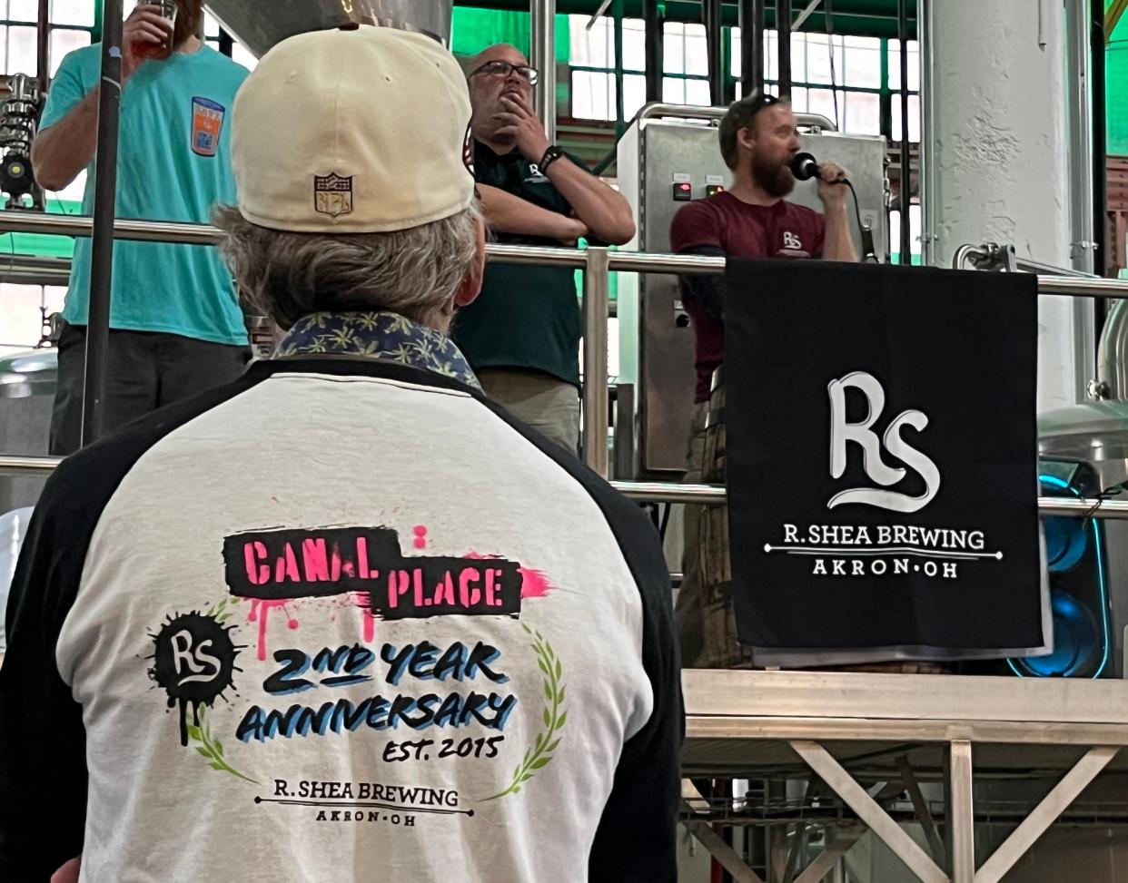 Ron Shea, co-founder of R. Shea Brewing Co., speaks to fans at a town hall meeting Sunday at the Canal Place production brewery.