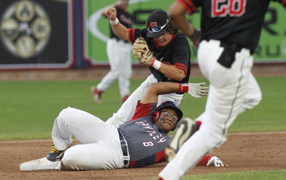 Hartley's DuShaun Tucker is tagged out by Chardon's Will Francis during the state semifinal.