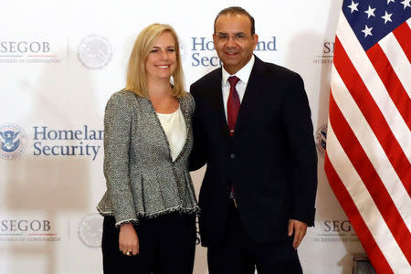 U.S. Homeland Security Secretary Kirstjen Nielsen and Mexico's Interior Minister Alfonso Navarrete Prida pose for a picture after delivering a joint message in Mexico City, Mexico March 26, 2018. REUTERS/Edgard Garrido