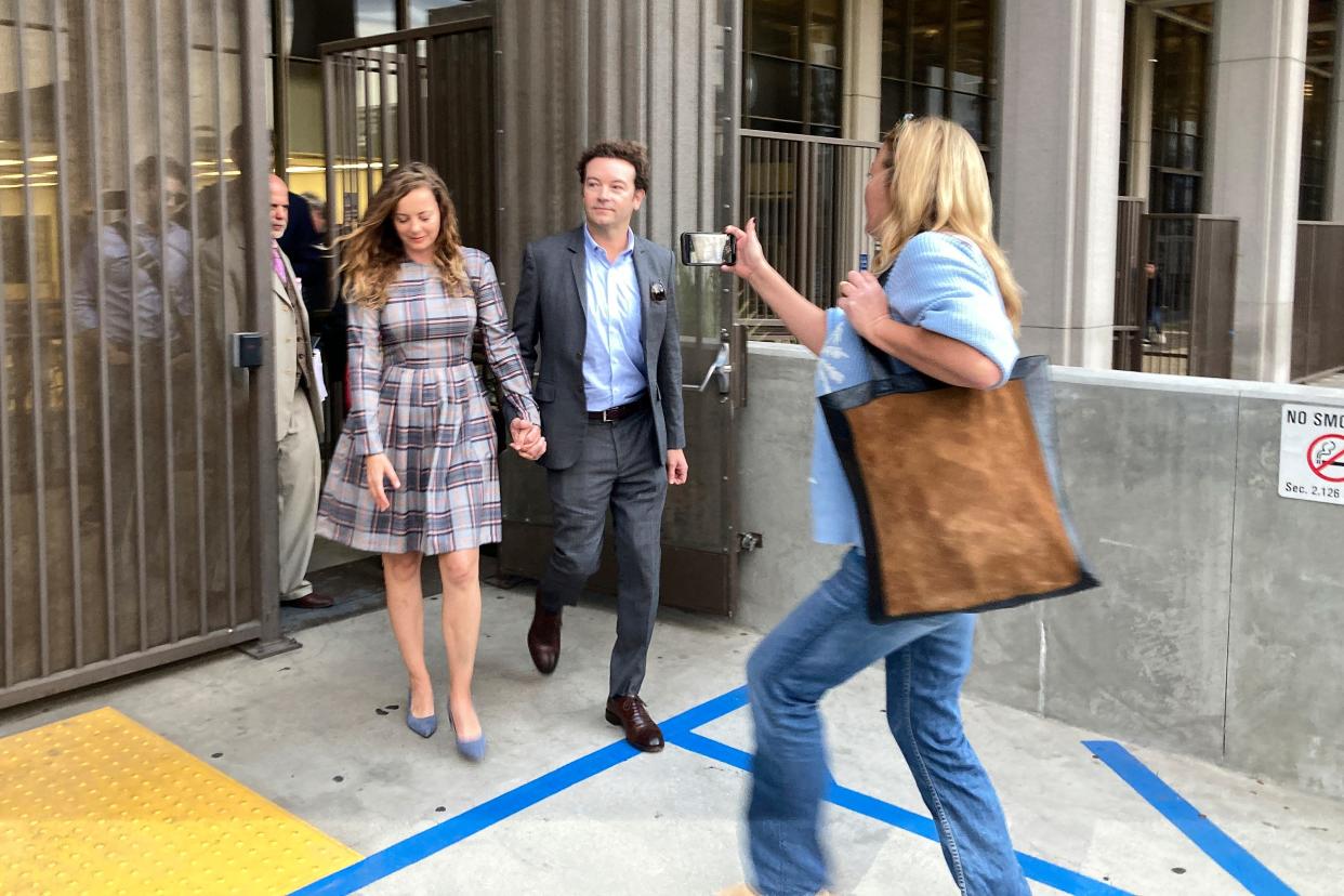 Danny Masterson leaves Los Angeles superior Court with his wife Bijou Phillips after a judge declared a mistrial in his rape case in Los Angeles on Wednesday, Nov. 30, 2022.