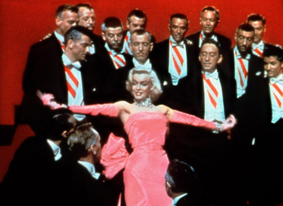 GENTLEMEN PREFER BLONDES, Marilyn Monroe, George Chakiris (far right), 1953, TM and Copyright (c) 20th Century Fox Film Corp. All rights reserved. Courtesy: Everett Collection.