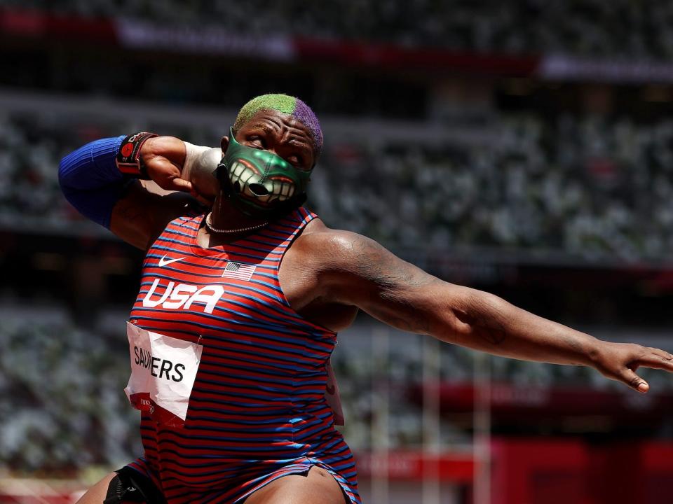 Raven Saunders wears a Hulk mask while shotputting at the Tokyo Olympics.