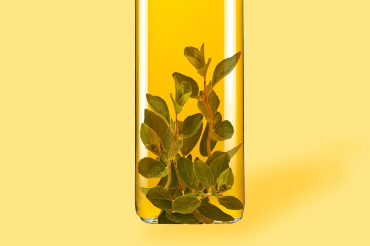 Close up of Oregano leaves inside oil bottle