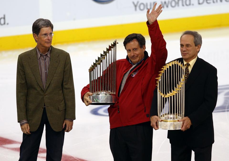 BOSTON - NOVEMBER 01:  (L-R) Boston Red Sox owner John Henry, Tom Werner and Larry Lucchino greet the fans before the Boston Bruins take on the Buffalo Sabres on November 1, 2007 at the TD Banknorth Garden in Boston, Massachusetts.  (Photo by Elsa/Getty Images)