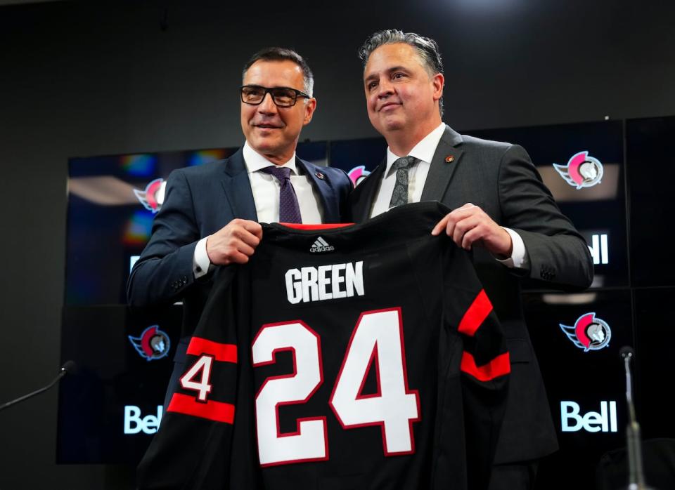 Ottawa Senators general manager Steve Staios, left, announces Travis Green as the team's new head coach in Ottawa on Wednesday, May 8, 2024. 