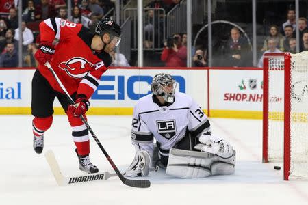 Dec 12, 2017; Newark, NJ, USA; New Jersey Devils left wing Taylor Hall (9) scores a goal on Los Angeles Kings goalie Jonathan Quick (32) during the second period at Prudential Center. Mandatory Credit: Ed Mulholland-USA TODAY Sports