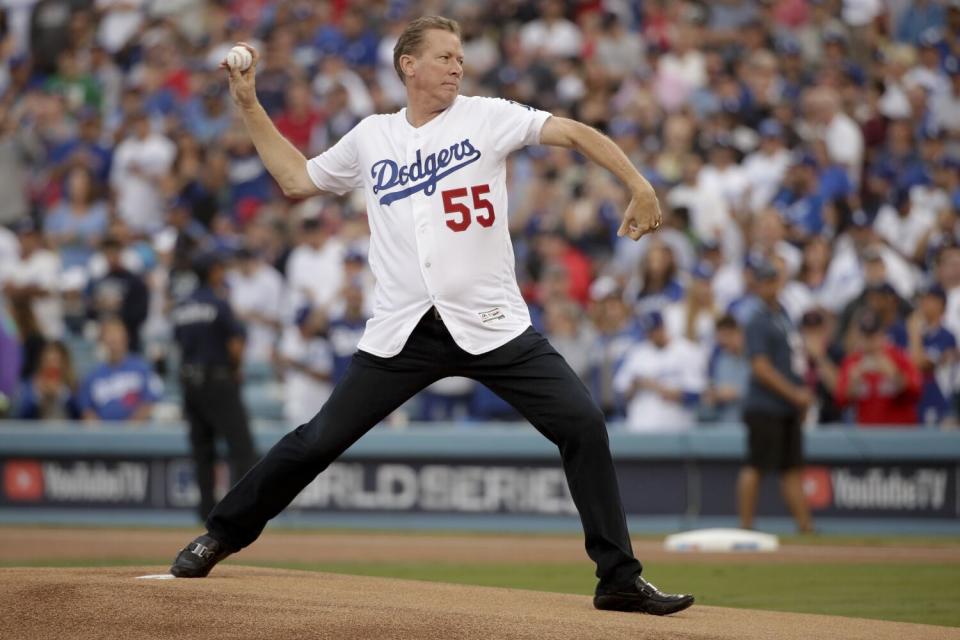 Former Dodger Orel Hershiser throws a pitch