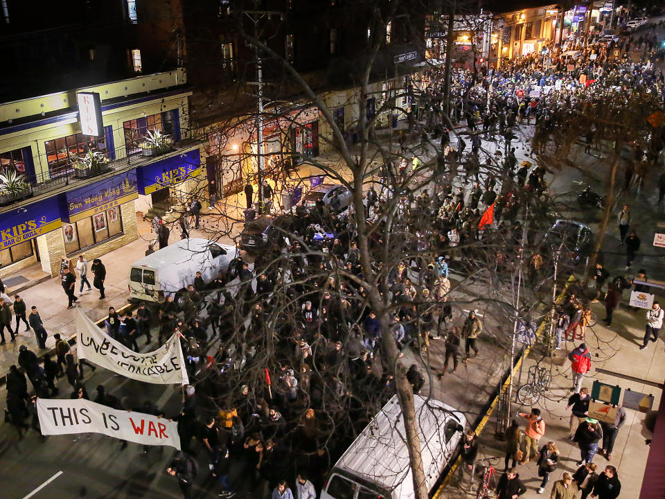 People protesting controversial Breitbart writer Milo Yiannopoulos march in the street in Berkeley, California: Getty