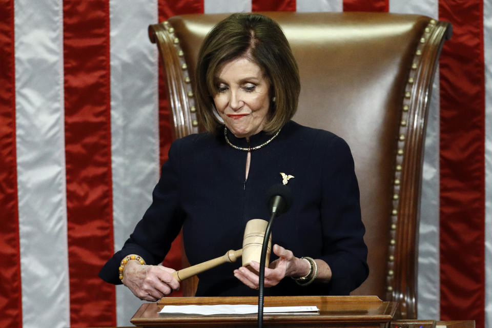 House Speaker Nancy Pelosi of Calif., holds the gavel after announcing the passage of the second article of impeachment, obstruction of Congress, against President Donald Trump by the House of Representatives at the Capitol in Washington, Wednesday, Dec. 18, 2019. (AP Photo/Patrick Semansky)