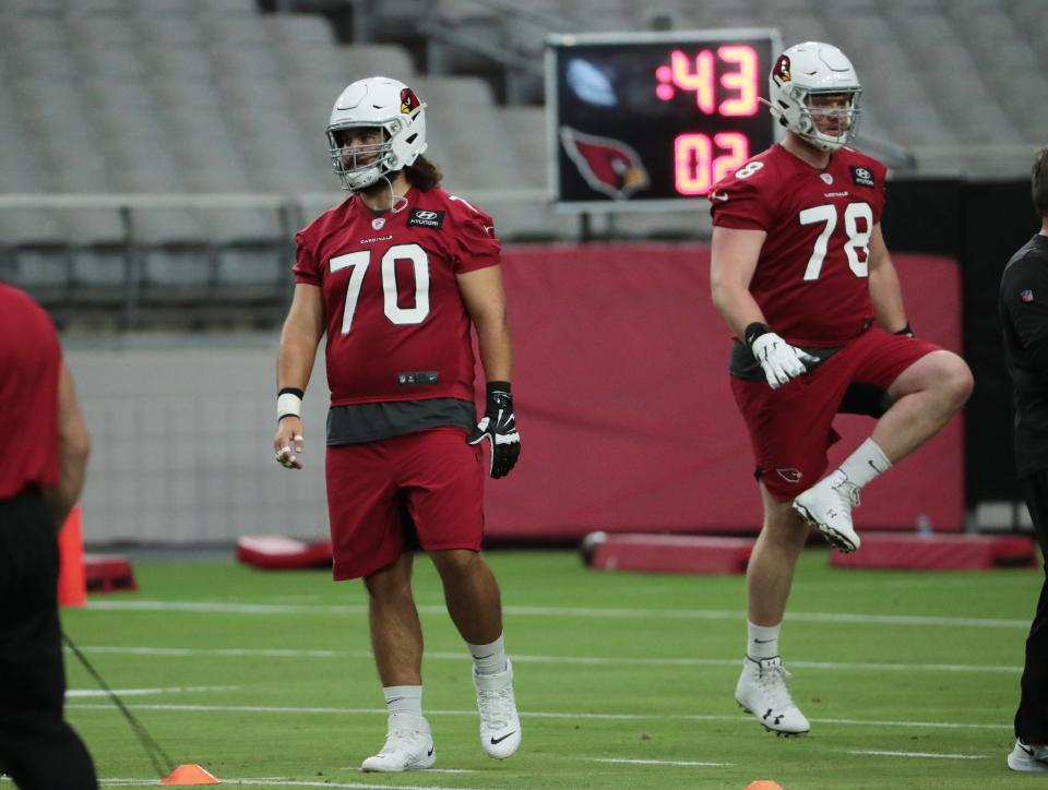 Arizona Cardinals offensive guard Sam Jones (70) and offensive lineman Brett Toth (78) warm up during practice at State Farm Stadium August 12, 2020. This was the first day of training camp.<br>Cardinals Training Camp