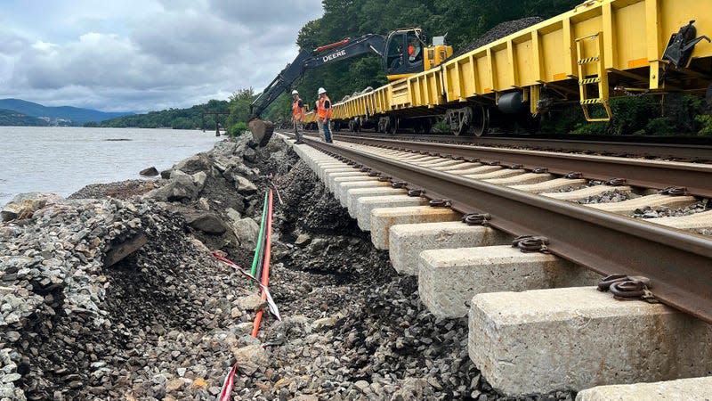 MTA workers assess flood damage to train tracks after a flash flood, Monday, July 10, 2023, near Manitou, N.Y. The heavy rain seemingly travelled north. 