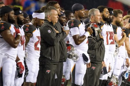 Aug 24, 2018; Tampa, FL, USA; Tampa Bay Buccaneers quarterback Jameis Winston (3) and head coach Dirk Koetter (right of winston) stand for the national anthem prior to the game against the Detroit Lions at Raymond James Stadium. Mandatory Credit: Douglas DeFelice-USA TODAY Sports