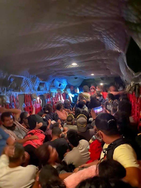 People are evacuated on a California National Guard Chinook helicopter after the Creek Fire in Mammoth Pool, California