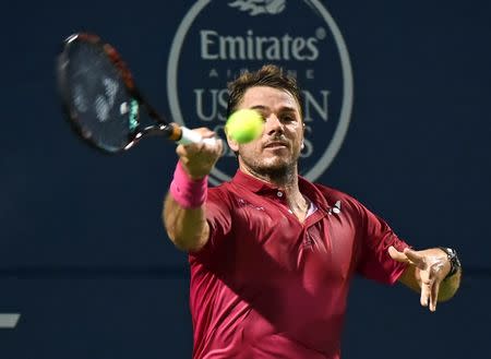 Jul 26, 2016; Toronto, Ontario, Canada; Stan Wawrinka of Switzerland hits a shot against Mikhail Youzhny of Russia on day two of the Rogers Cup tennis tournament at Aviva Centre. Mandatory Credit: Dan Hamilton-USA TODAY Sports