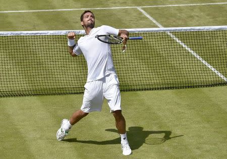 Viktor Troicki of Serbia celebrates after winning his match against Dustin Brown of Germany at the Wimbledon Tennis Championships in London, July 4, 2015. REUTERS/Toby Melville