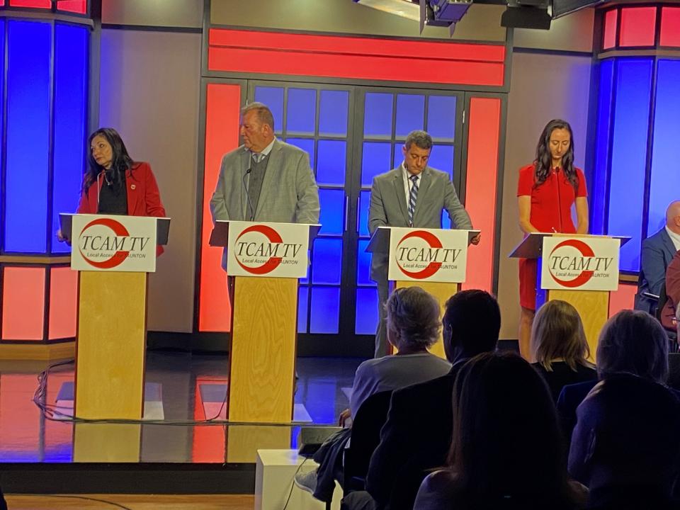 From left to right: Taunton City Councilors Estele Borges, John McCaul, Lawrence Quintal, and Kelly Dooner on stage during TCAM's candidates night for City Councilor candidates on Oct. 26.