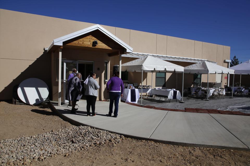 Family Crisis Center staff members gather outside the new extension to Marge's Place, the organization's shelter for domestic violence victims, during an Oct. 19 open house celebration in Farmington.