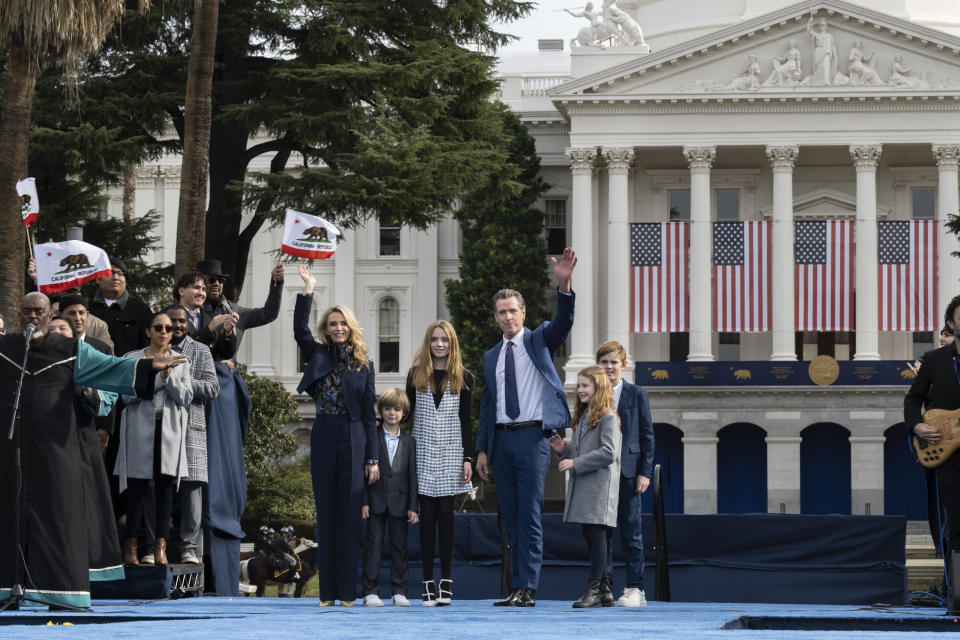 CORRECTS SPELLING OF SURNAME TO NEWSOM - Governor Gavin Newsom with his wife Jennifer Siebel Newsom and children Dutch, left, Montana, Brooklynn, and Hunter, right, following the Inauguration of Governor Gavin Newsom in the Plaza de California in Sacramento, Calif., Friday, Jan. 6, 2023. (AP Photo/José Luis Villegas)