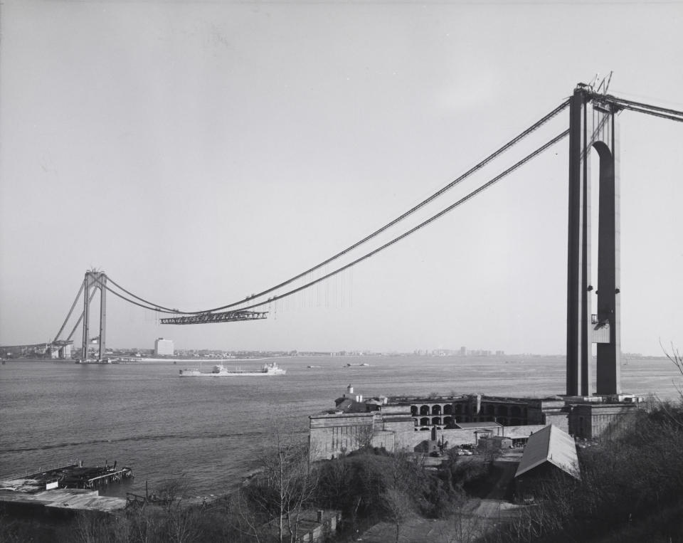 This Dec. 4, 1963 photo provided by the Museum of the City of New York shows New York's Verrazano-Narrows Bridge, linking Brooklyn to Staten Island, under construction. Beyond the ferry, the Verrazano-Narrows Bridge and maybe the Fresh Kills landfill, few people outside Staten Island know of its rich history as a strategic site in New York Harbor, a farming center, a recreational haven and a suburban retreat. A new exhibition aims to rectify that. “From Farm to City: Staten Island 1661-2012” opened at the Museum of the City of New York on Thursday and runs through Jan. 21. (AP Photo/Museum of the City of New York)