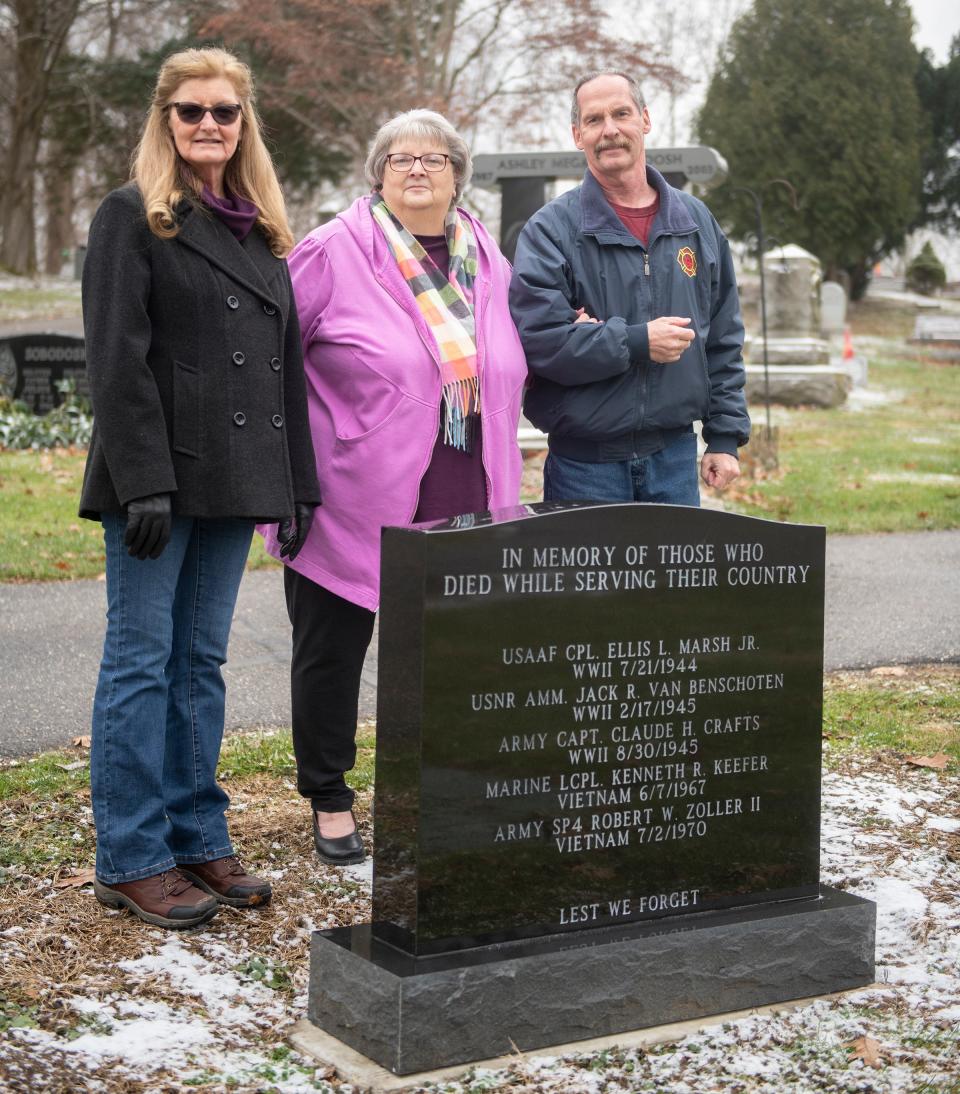 From left, Bonnie Zoller Collier, Mantua Mayor Linda Clark and local historian Tim Benner stand by a recently installed memorial honoring local servicemen who were killed in action. Collier, who made a significant donation to the project, lost her older brother Robert Zoller when he was killed in Vietnam in 1970 and his is one of five names on the monument. Benner proposed creating the monument to Clark, who was supportive, and did much of the necessary research for it and for similar monuments planned for Mantua Township.