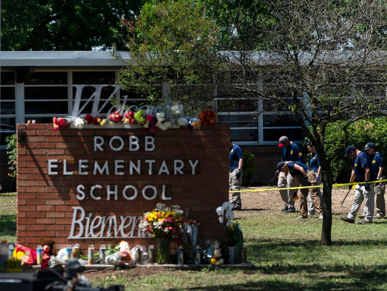 Investigators search for evidences outside Robb Elementary School in Uvalde, Texas, May 25, 2022, after an 18-year-old gunman killed 19 students and two teachers. The district’s superintendent said Wednesday, June 22, that Chief Pete Arredondo, the Uvalde school district’s police chief, has been put on leave following allegations that he erred in his response to the mass shooting.