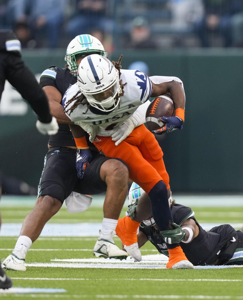 UTSA wide receiver Joshua Cephus carries on a pass reception in the first half of an NCAA college football game against Tulane in New Orleans, Friday, Nov. 24, 2023. (AP Photo/Gerald Herbert)