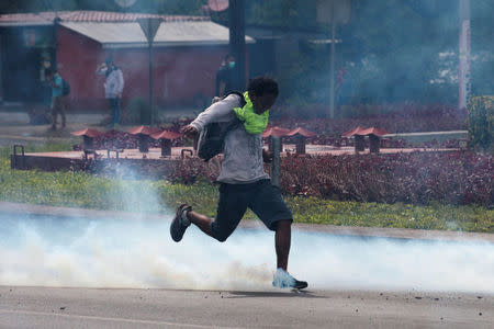 A demonstrator kicks a tear gas canister during a protest over a controversial reform to the pension plans of the Nicaraguan Social Security Institute (INSS) in Managua, Nicaragua April 20, 2018. REUTERS/Oswaldo Rivas