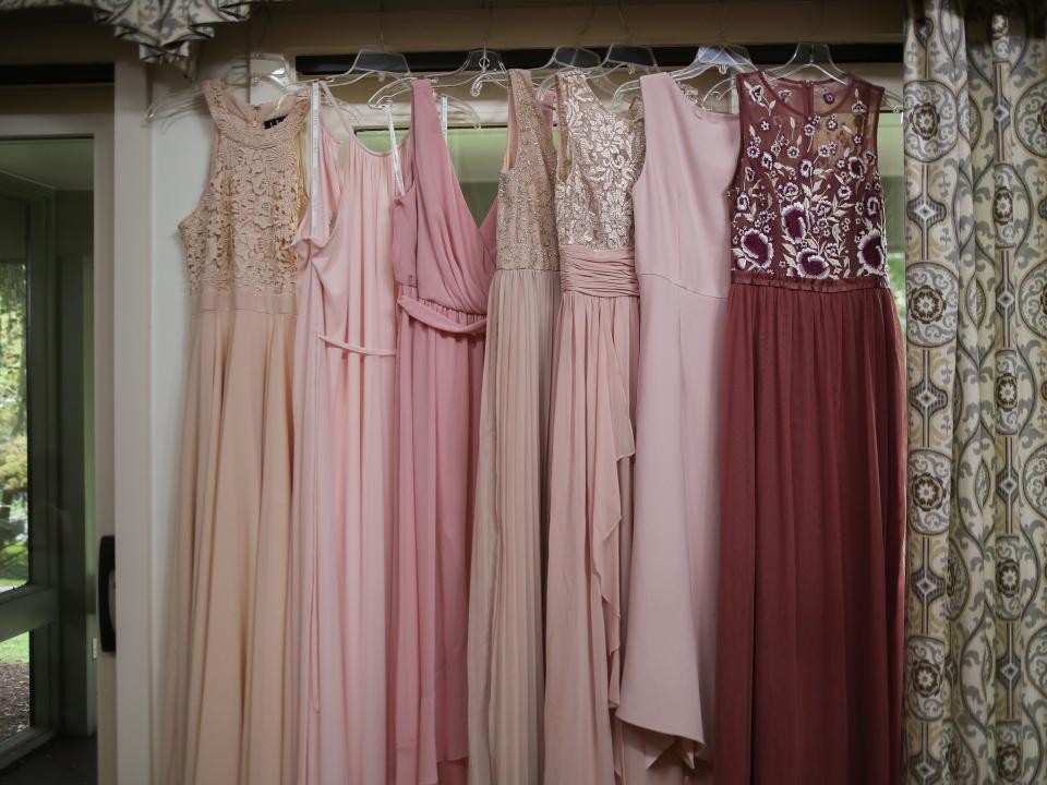 mismatched bridesmaid dresses on hangers