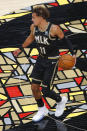 Atlanta Hawks guard Trae Young (11) drives down the court in the first half of an NBA basketball game against the Minnesota Timberwolves on Monday, Jan. 18, 2021, in Atlanta. (AP Photo/Todd Kirkland)